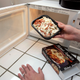 Abi Jones, of HeatEatReview.com, places a frozen food item for dinner and review into her microwave oven at her home in Palo Alto, Calif., Wednesday, March 5, 2008.